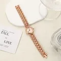 Elegant rose gold chain link watch with Roman numeral dial on a textured surface. - Rose Gold