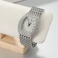 Macro view of full rhinestone tonneau watch with Roman numerals - Strap: 20*2.2cm, Dial Diameter: 3.8*4cm / Silver