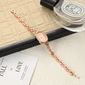 Elegant rose gold oval women's watch with a minimalist dial and link bracelet detail - Oval Bracelet Style / Rose Gold