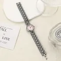 Detail view of retro ladies quartz watch with pink dial and silver chain strap - White Pink