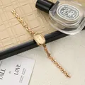 Close-up of vintage gold lady's watch with an elegant oval dial and bracelet strap - Oval Bracelet Style / Gold