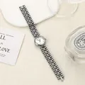 Elegant retro round quartz watch with refined gunmetal chain strap in studio setting - White White
