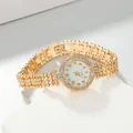 Detailed view of a luxury gold-plated bracelet watch for women featuring a rhinestone bezel - Gold