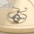 Detail of elegant silver clover bracelet watch with rhinestone-encrusted leaf links - Clover Stretch Bracelet Watch (Silver) / Silver