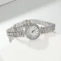 Close-up of luxury silver wristwatch for women with rhinestone bezel and beaded strap - Silver