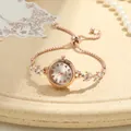 Macro detail of rose gold ladies bracelet watch with sparkling rhinestone leaf design - Clover Stretch Bracelet Watch (Rose Gold) / Rose Gold