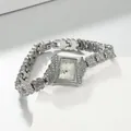 Detailed close-up of an elegant rhinestone-encrusted bracelet watch with a silver dial - Silver Case White Dial