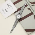 Detailed macro shot of an elegant silver quartz wristwatch with sparkling crystal bracelet - Silver