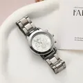Detailed view of a silver Geneva women's quartz watch with a metal link strap and white dial - Silver