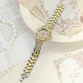Close-up of iced-out women's quartz watch in gold and silver tone alloy strap. - Two-tone (Gold & Silver)