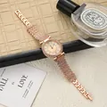 Elegant rose gold watch featuring a rhinestone bezel and Roman numeral dial details. - Rose Gold