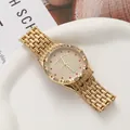 Detailed view of trendy gold quartz watch with red crystals and diamond-encrusted dial - Gold Men's