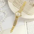 Elegant gold women's watch featuring a rhinestone dial and strap segments detail - Gold