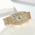 Close-up of luxury gold tonneau watch with full diamond rhinestones and large numerals. - Band: 15.5*2.2cm, Dial: 3.7*4.1cm / Gold