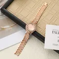 Close-up of elegant rose gold women's watch with rhinestone bezel and strap - Rose Gold