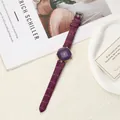 Close-up of elegant purple hexagonal quartz watch with crocodile pattern strap. - Purple