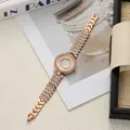 Detailed view of rose gold women's watch with full rhinestone strap and moving beads - Rose Gold