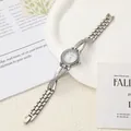 Detailed view of the criss-cross rhinestone strap and round dial of this luxury ladies watch - Length 19.2cm Dial 2.2cm / Silver