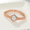 Close-up of rose gold ladies' watch with rhinestone bezel and link bracelet - Bracelet / Rose Gold Case White Face