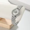 Close-up of elegant silver butterfly watch with rhinestone-encrusted bracelet. - 19cm/2.9cm / White