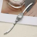 Elegant silver women's quartz bracelet watch with sparkling rhinestone detailing. - Silver