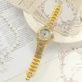 Elegant gold-tone iced-out women's quartz watch with full rhinestone dial and metal link bracelet. - Gold