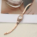 Elegant rose gold vintage bracelet watch for women featuring a sparkling rhinestone bezel - Rose Gold