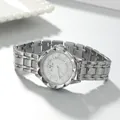 Detailed macro view of elegant silver steel band ladies watch with rhinestone-encrusted dial - Silver Steel Band (Blue Stone) / 3.2cm Dial / White