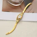 Detailed view of a vintage gold bracelet watch for women with rhinestone accents - Gold