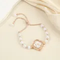 Elegant clover-shaped quartz watch for women with pearl bracelet and shiny rhinestones - Flower Style
