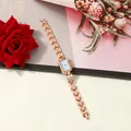 Close-up of elegant rose gold ladies watch with square light blue dial and link bracelet - Rose Gold With Blue Dial