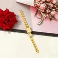 Elegant gold square quartz watch for women with stylish link bracelet on floral backdrop - Gold With Gold Dial