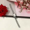 Elegant square women's quartz watch with silver link bracelet against a floral backdrop - Silver With Pink Dial