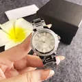 Close-up of elegant silver women's watch with rhinestone bezel and Roman dial - Silver
