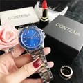 Detailed macro view of Contena silver and gold business watch with blue dial and date - 1