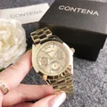 Luxurious gold CONTENA quartz chronograph watch detail held by hand with gift box - Gold