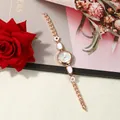 Detail view of elegant rose gold bracelet watch with white enamel inserts - Rose White