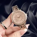 Detailed macro shot of a rose gold lady's watch with crystal-encrusted bezel and strap - Rose Gold