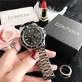 Detail view of business couple watch featuring two-tone metal band and black dial face - 2