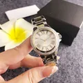 Close-up of a luxury women's quartz watch with diamond bezel and gold steel band - Two-tone (Gold & Silver)