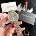 Close-up detail of luxury gold watch fully encrusted with shimmering rhinestones - Gold