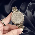 Macro view of women's luxury vintage watch featuring crystal bezel and geometric strap - Two-Tone Silver and Gold