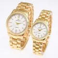 Close-up view of high-quality gold-toned quartz couple watches with steel link bands - Men's Gold Case White Dial