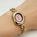 Montre à quartz élégante pour femme avec cadran ovale rose et bracelet à maillons dorés - Boîtier Or Cadran Rose