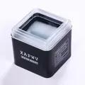 Gros plan sur la boîte de montre carrée noire XAPWV avec couvercle transparent et mousse - Noir Transparent