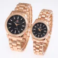 Vista ravvicinata di un set di orologi coppia in oro rosa con quadranti neri e acciaio - Oro Rosa Quadrante Nero Uomini