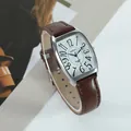 Detailed view of XAPWV tonneau watch with brown leather strap and distorted numerals - Men's (Brown Strap Silver Case)