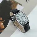 Detail of tonneau-shaped quartz watch with black leather strap and bold numerals. - Men's (Black Strap Silver Case)