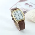 Macro detail of XAPWV business watch featuring a tonneau gold case and brown leather strap - Men's (Brown Strap Gold Case)