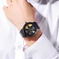 Close-up of men's quartz watch featuring a black car wheel rim dial and yellow hands. - Yellow (GS734)
